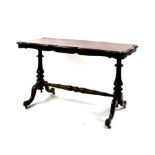 A 19th century rosewood centre table on turned supports joined by a stretcher, 113cm (44.5ins) wide