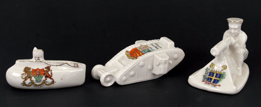 Three pieces of WWI crested ware to include a Grafton china tank, an Arcadian submarine and an