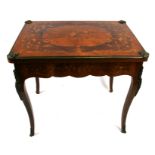 A French marquetry inlaid ormolu mounted fold-over card table, 81cms (32ins) wide.