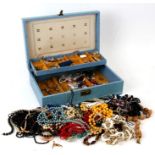 A blue jewellery box containing costume jewellery