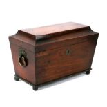 An early 19th century mahogany sarcophagus shaped three division tea caddy, 33cms (13ins) wide.