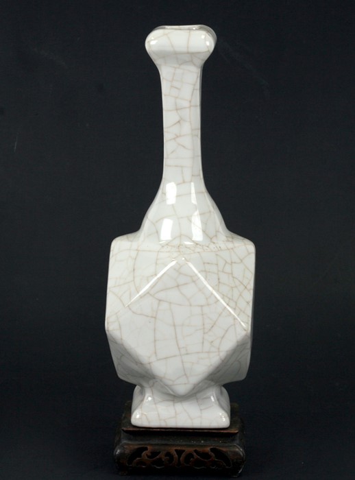 A Chinese crackle glaze vase on a pierced hardwood stand, 23cms (9ins) high.Condition Report Stand