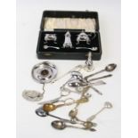 A boxed silver plated cruet set; together with souvenir spoons and other items.