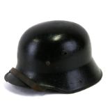 An M16 Imperial German helmet with liner and chin strap.