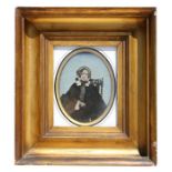 A large Victorian ambrotype of an old lady, mounted in a heavy gilt frame, 17 by 20cms (6.25 by