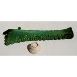 A 19th century Chinese green stained bone tusk display stand in the form of breaking waves, 31cms (