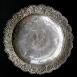 A Persian/Indian dish with scrolling foliate border (not tested) 26cm (10.25ins) diameter