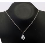 A silver pendent and chain by Elanza