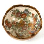 A Japanese Satsuma miniature bowl decorated with flowers on a cream ground with gilt highlights, 6cm