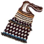 A tribal bead work bag, possibly Native American.