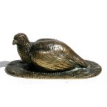 A 19th century bronze figure of a quail, 12cms (4.75ins) long.
