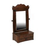 A 19th century figured mahogany toilet mirror, 44cms (17.25ins) wide.