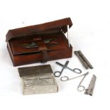 An early 20th century Army Field Surgeons medical kit in its brown leather case. Overall 21cms (8.