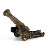 A Cope & Collinson Patent bronze cannon on carriage, 38cms (15ins) long.