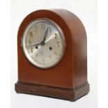 A mahogany cased mantle clock, the silver dial with Arabic numerals, 31cms (12.25ins) high.