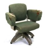 A Tan-Sad mid 20th century upholstered swivel desk chair.