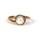 A 9ct gold ring set with a single pearl, approx UK size 'N'. 3.1g