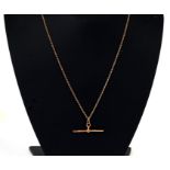 A 9ct gold (tested) necklace with 9ct rose gold 'T' bar, weight 9.9g.