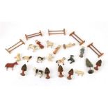A group of early 20th century naive carved and painted wooden miniature farmyard figures to