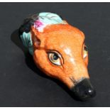 A ceramic Staffordshire stirrup cup in the form of a foxes head with a vine & grape collar