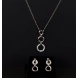 A 9ct white gold pendant and earring set of geometric design. 5.7g