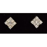 A pair of 18ct white gold diamond earrings set with a total of 26 mixed cut diamonds, approx 0.55