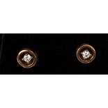 A pair of 9ct diamond stud earrings.