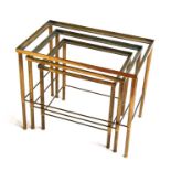 A nest of three modern design brass tables, the largest 54cms (21.25ins) wide (all tables lack
