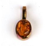 A 14ct gold yellow stone pendant. 1.9g