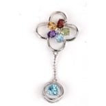 An 18ct white gold pendant set with multi coloured stones. 1.8g