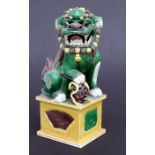 A Chinese glazed pottery temple lion, 30cms (12ins) high.