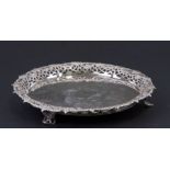 A silver salver, London 1760, with ornate cast and pierced border standing on three feet, weight