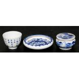 A Chinese blue & white tea bowl decorated with calligraphy, 5cms (2ins) high; together with a