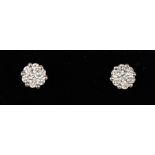 A pair of 18ct white gold diamond cluster earrings.