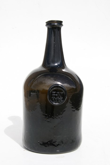 An 18th century dark amber glass seal bottle, initialled 'IN' and dated 1772, 23cms (9ins) high. - Image 7 of 7