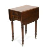 A 19th century mahogany drop flap work table with two drawers and two faux drawers, on tapering