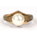 A 14ct gold ring (stamped 14K) untested, set with a single pearl, approx UK size 'N'. 2.6g