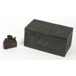A Persian bronzed metal box decorated with foliate scrolls, 17cms (6.75ins) wide; together with a