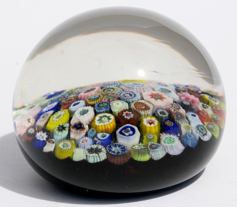 A millefiore glass paperweight, 7.5cms (3ins) diameter.