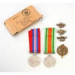 A WW2 Auxiliary Territorial Service ATS brass badges, medal pair and posting box addressed to Mrs CV