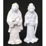 A pair of late 19th century Japanese Hirado figures depicting a man and a woman, the largest