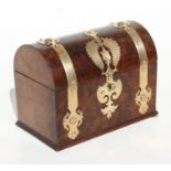 A Victorian figured walnut dome topped two-division tea caddy with applied brass strapwork