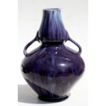 An early 20th century Christopher Dresser design purple glazed two-handled vase, 25cms (9.75ins)
