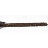 A 19th century Indian parasol with large finely carved hardwood handle depicting animals amongst