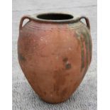 A large two-handled terracotta olive jar, 47cms (18.5ins) high.