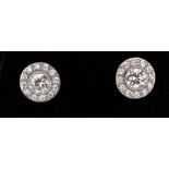 A pair of 18ct gold diamond cluster stud earrings, each with central brilliant cut diamond