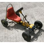 A vintage Coloma pedal go-kart.