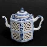 A Chinese reticulated blue & white tea pot of hexagonal form decorated with foliage, 13cms (5ins)