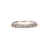 A 9ct white gold half eternity ring, approx UK size 'L'. 1.2g