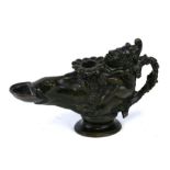 A Grand Tour style bronze oil lamp depicting Punchinello riding a horses head, 15cms (6ins) wide.